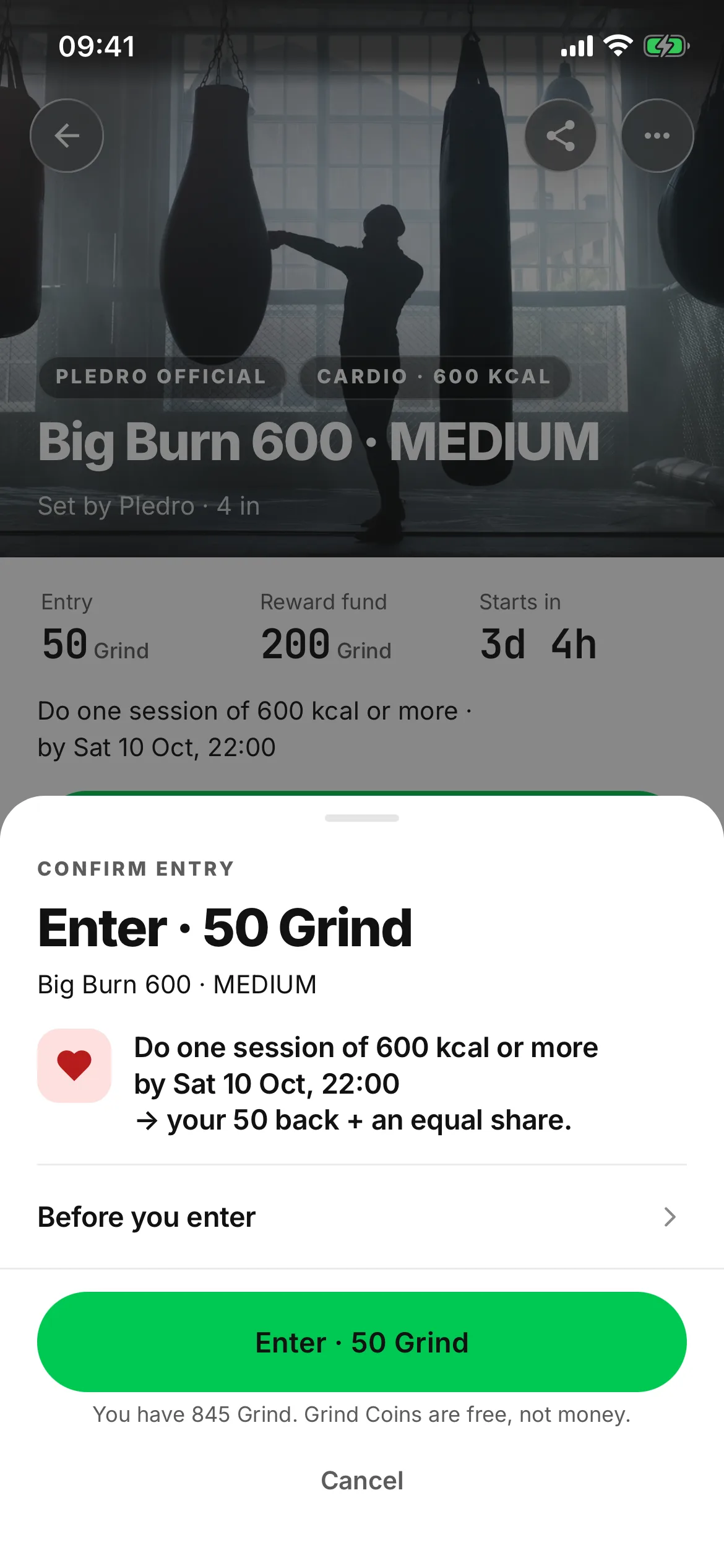 The pop-up that opens on Enter: Confirm entry, Enter · 50 Grind, one line saying what to do, by when, and that you get your 50 back and an equal share, a Before you enter row, and the green Enter button over a line saying Grind Coins are free, not money.