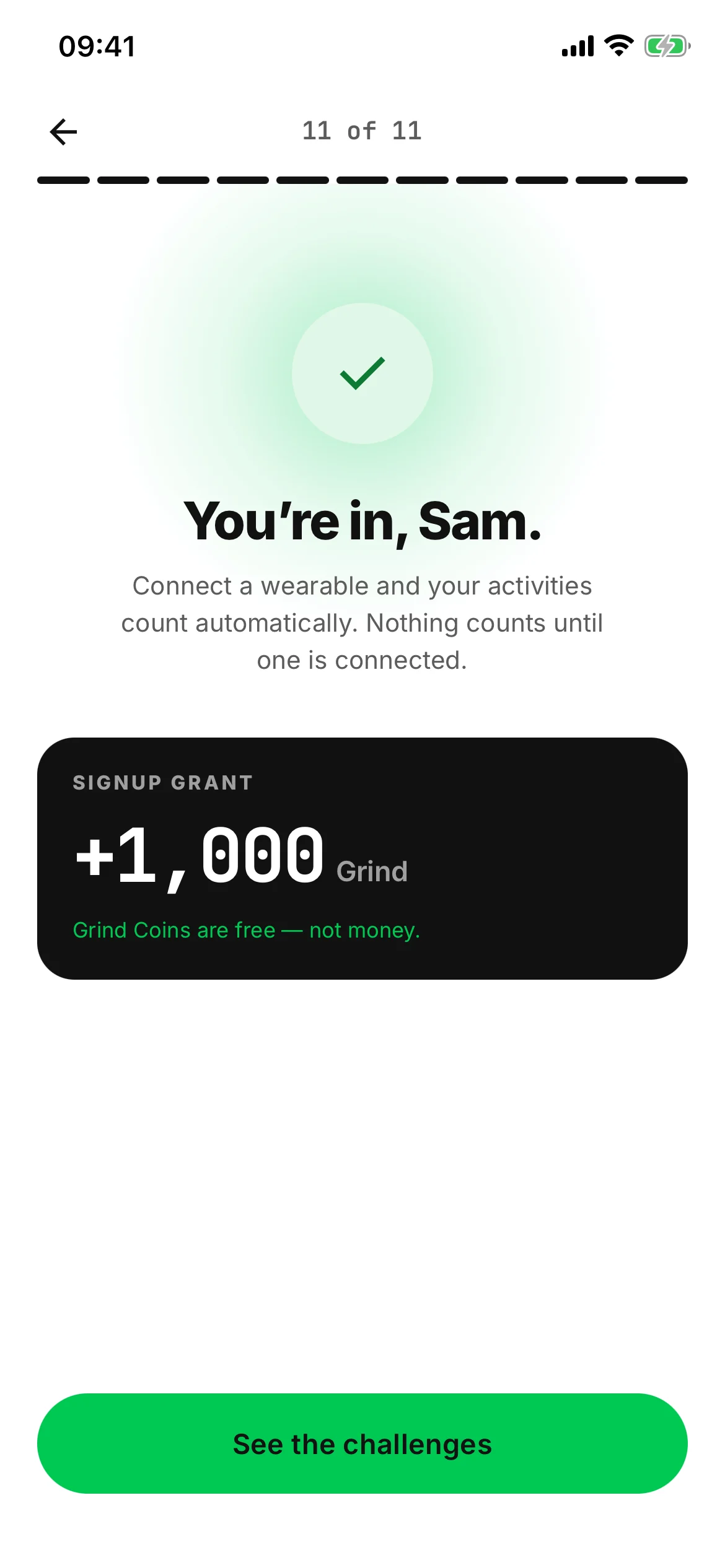 The last page of signing up: You’re in, Sam. — connect a wearable and your activities count automatically — and a signup grant of 1,000 Grind Coins, which are free and not money, above See the challenges.