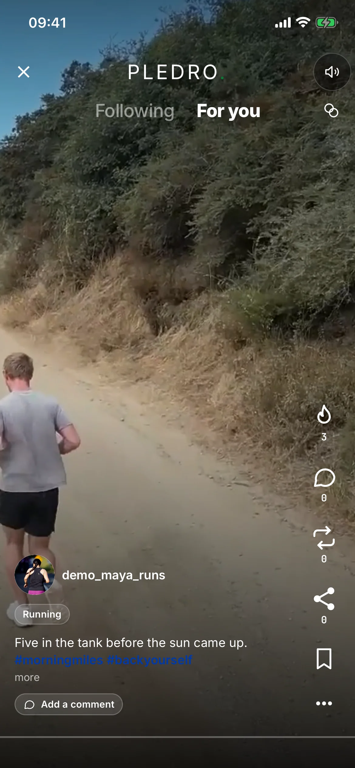 A reel playing full-screen: a runner on a dirt trail, the like, comment, repost, share and save marks down the right edge, and the author, sport tag and caption along the bottom.