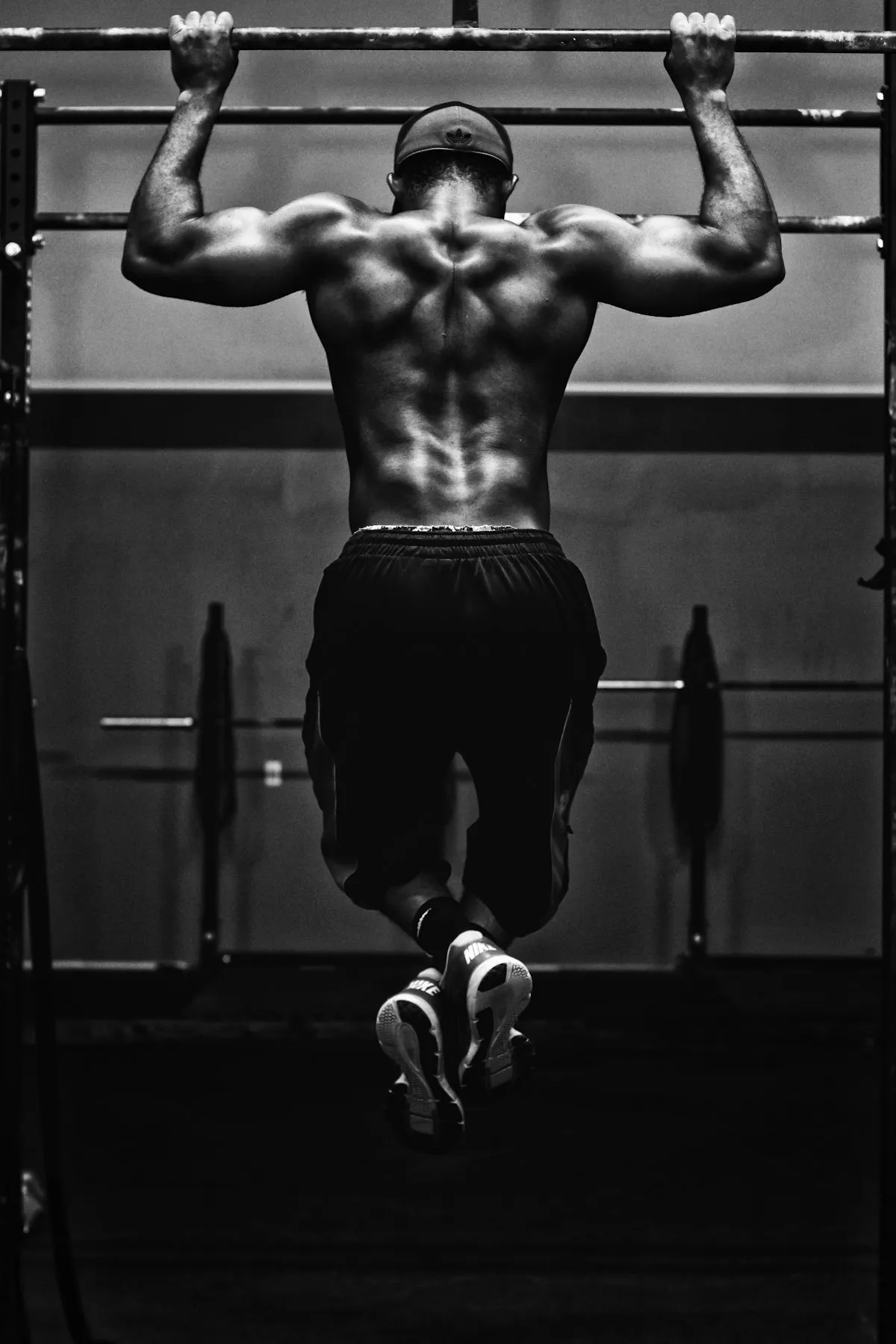 A pull-up mid-rep, every muscle working.